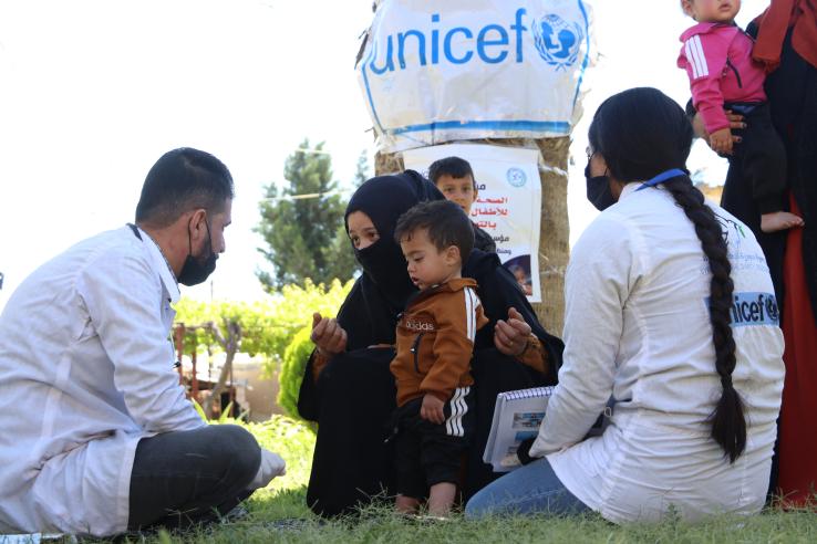 UNICEF humanitarian setting with mother and kid