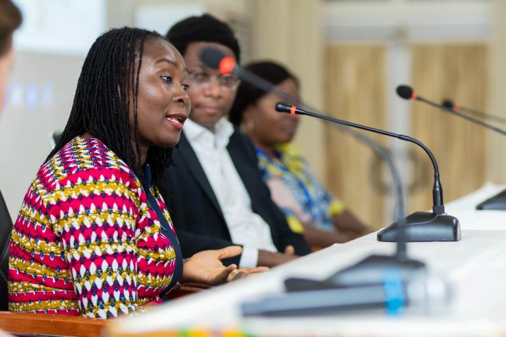 Panel of two women and one man speaking