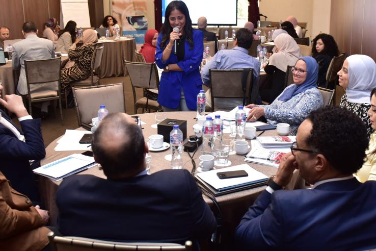 Group roundtable with lady holding mic