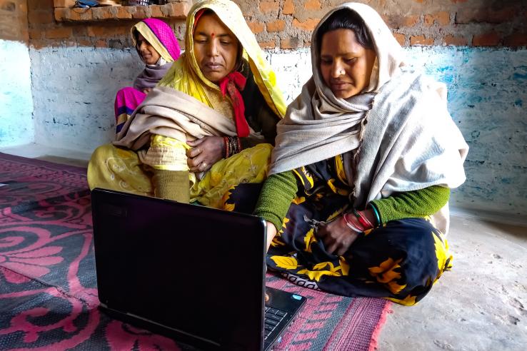 Women looking through things on a laptop