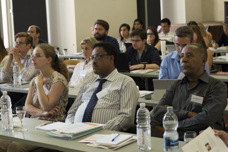 Group of people participating in lecture event