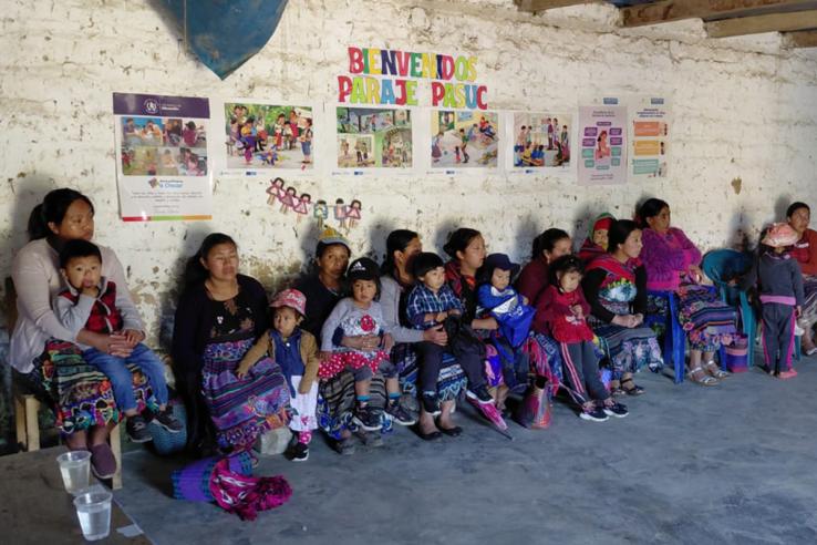 Caregivers and children at a community center where Acompáñame a Crecer is implemented in Guatemala.