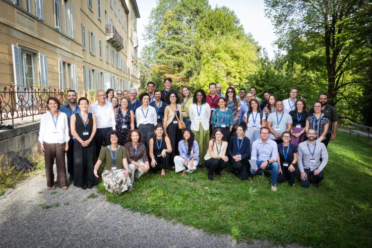 Group of people posing for picture at a university garden