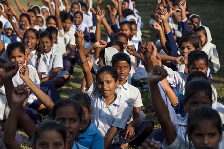 Young students in India sitting outside