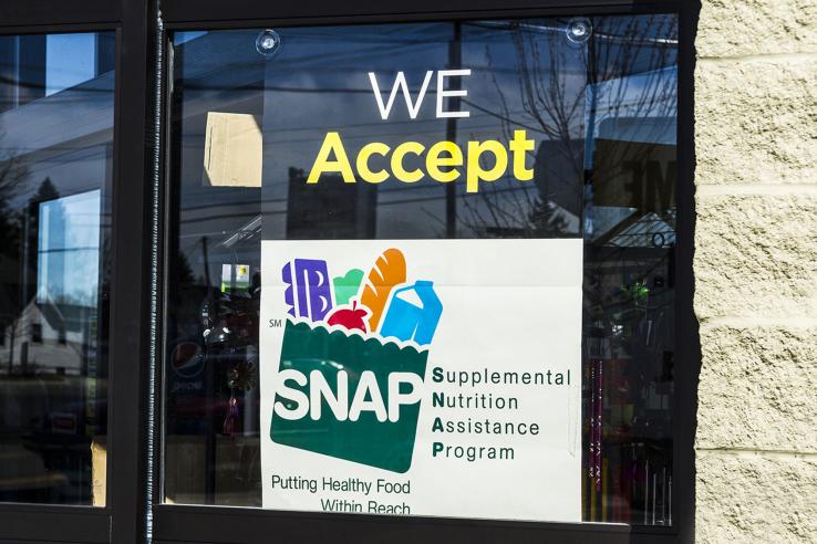 Sign on store front that business accepts Supplemental Nutrition Assistance Program (SNAP)
