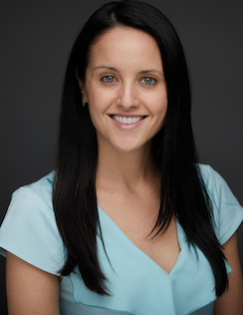 Head shot of Laura Boudreau wearing blue shirt