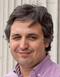 Head shot of Pedro Carneiro in purple shirt