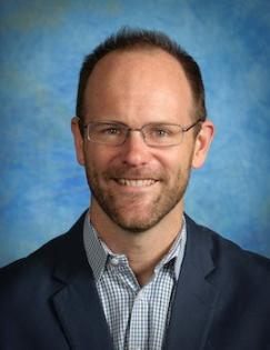 A headshot of a man