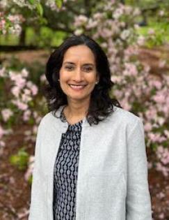 Headshot of Ina Ganguli in a gray blazer