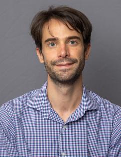 A headshot of a man