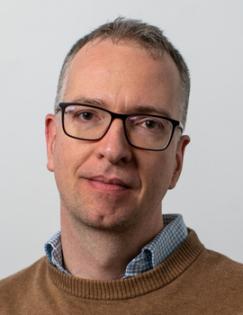 Adam Szeidl Headshot