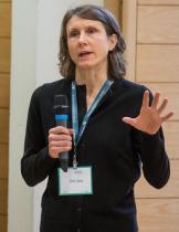 Headshot of Clare Leaver wearing a black shirt