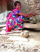 Sheela Devi making a ceramic object