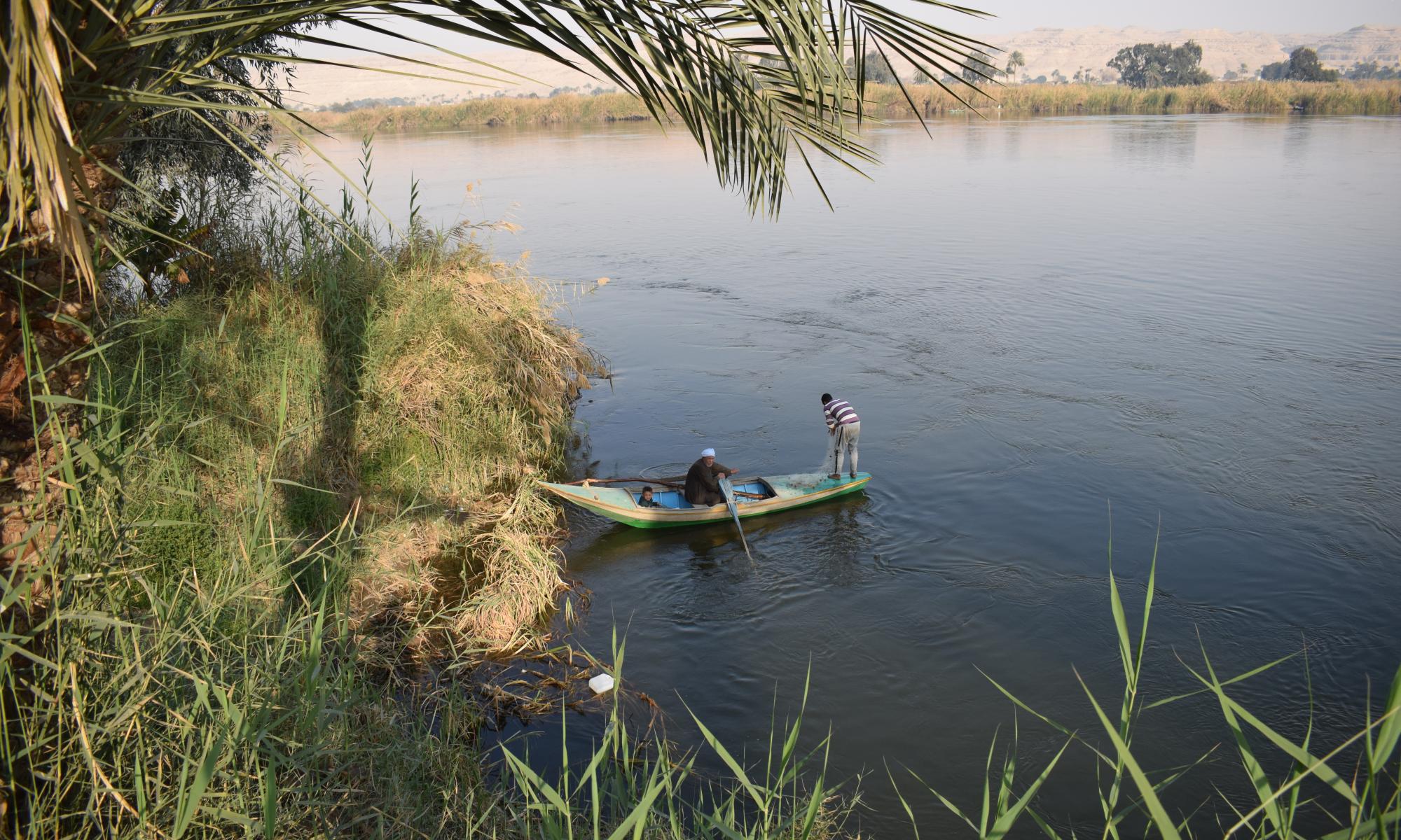 Two men in boat in river