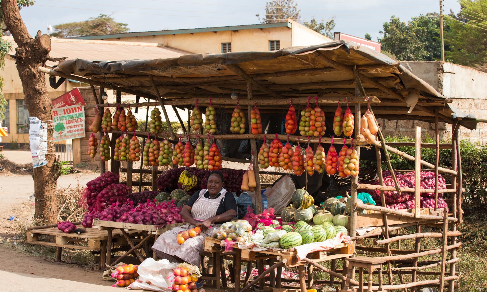 Person selling wares at a market in Africa