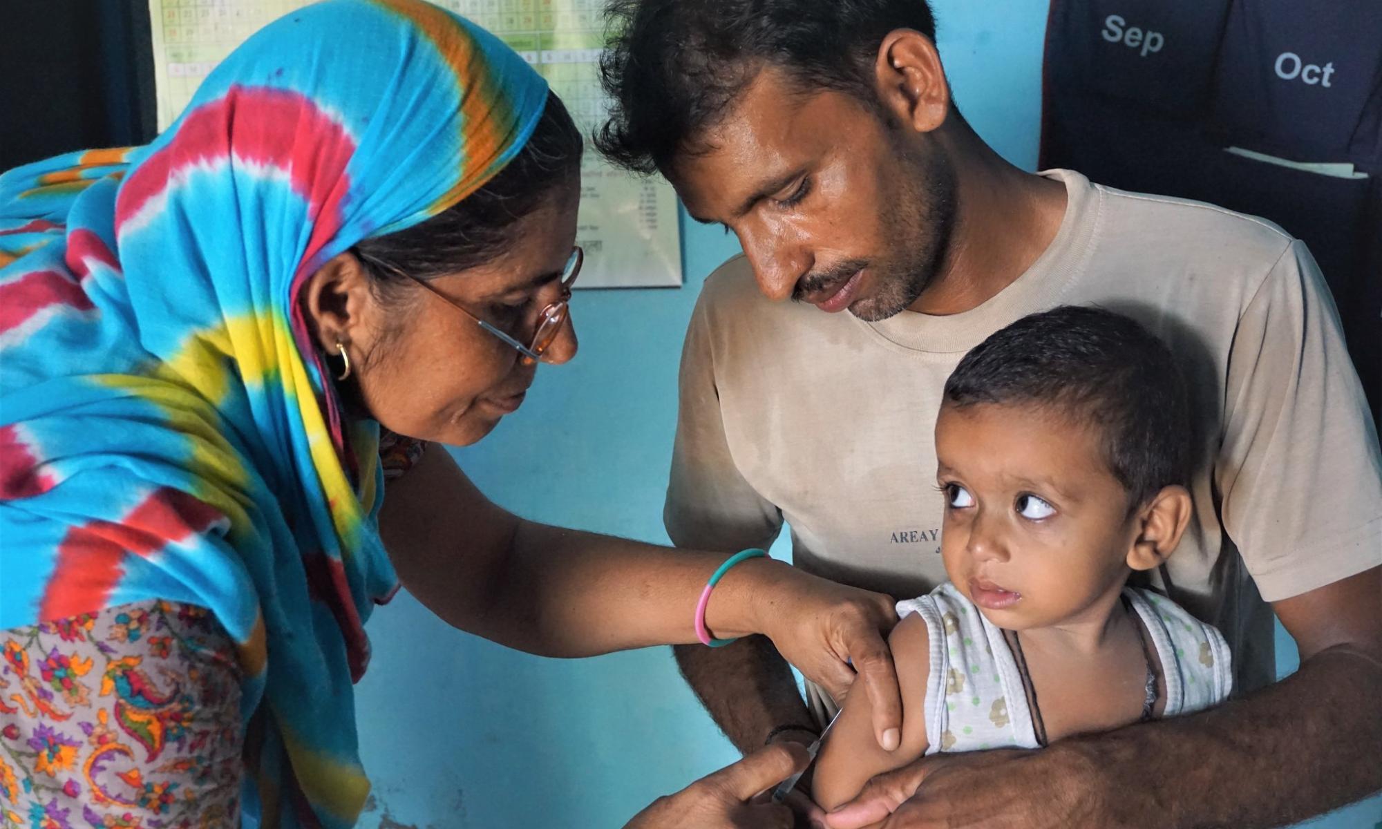 A child receiving an immunization dose in Haryana, India.