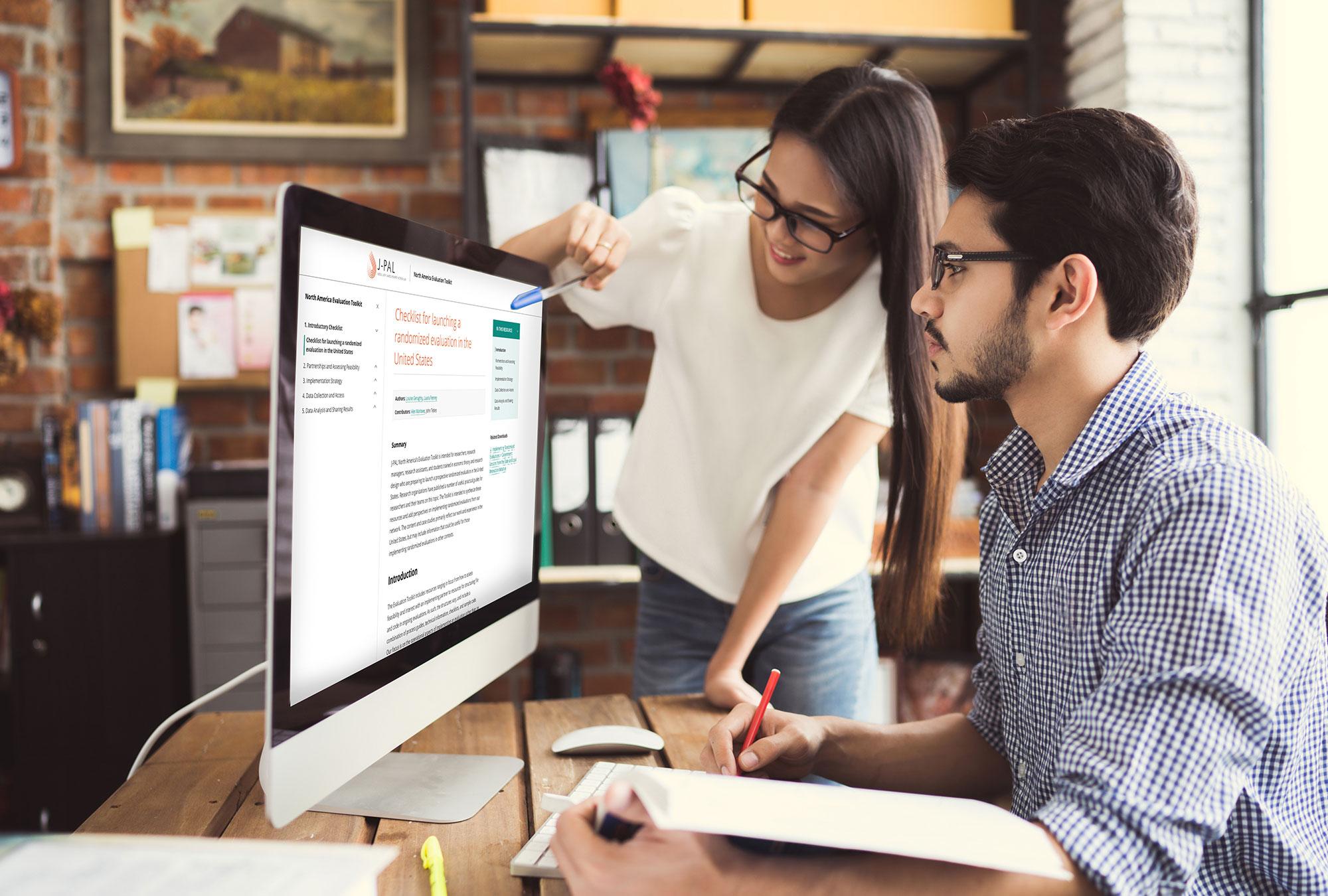 two people looking at a computer screen