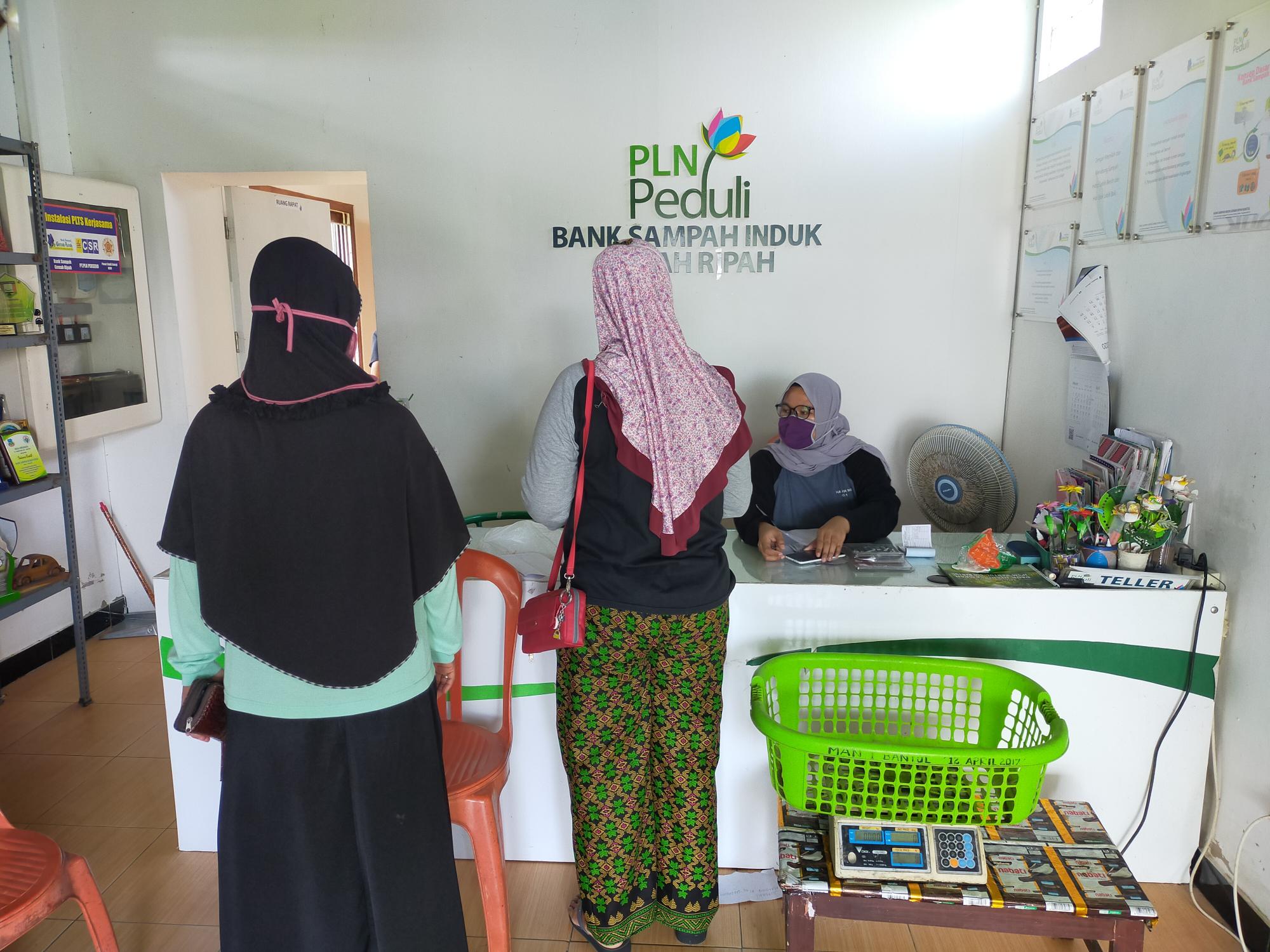 Two women in line at bank