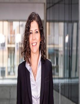 Alexia Delfino in a black coat