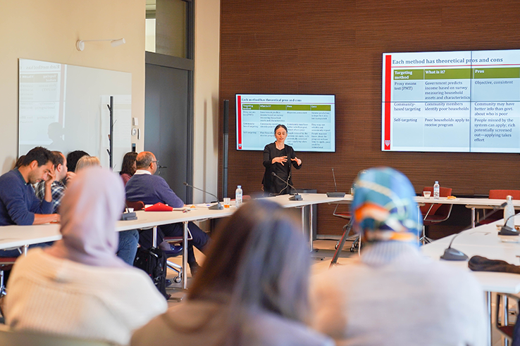 Rema Hanna teaching to a classroom 