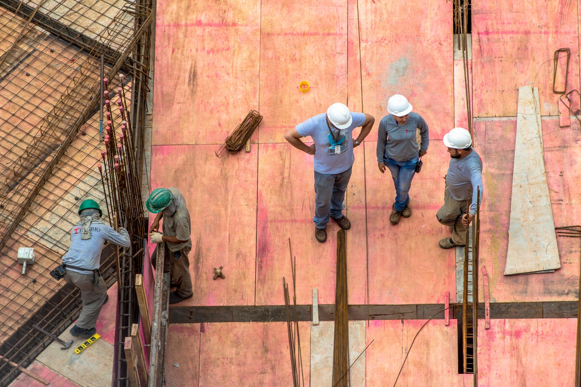 Workers constructing a building