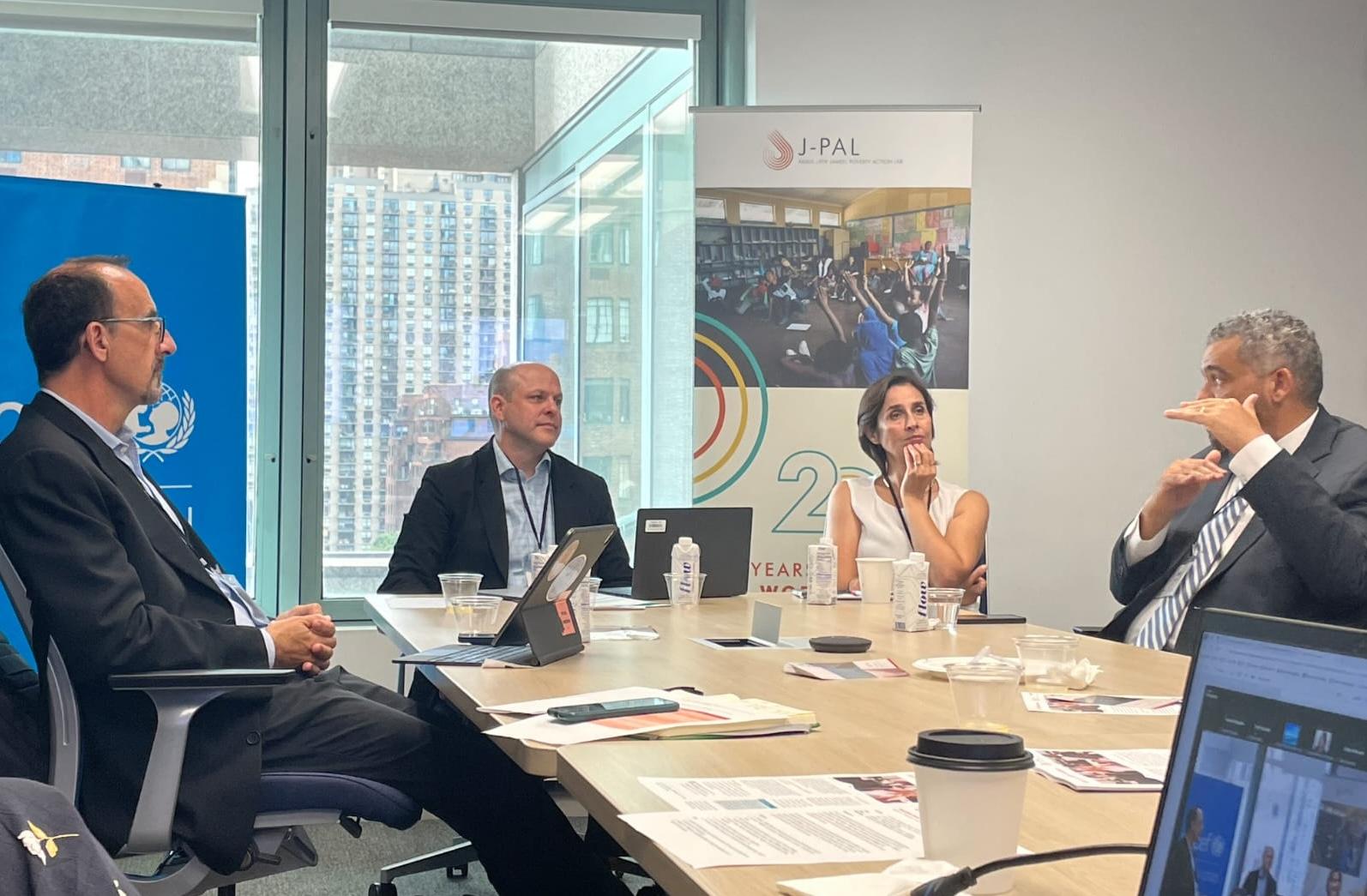 Four people sitting at a table