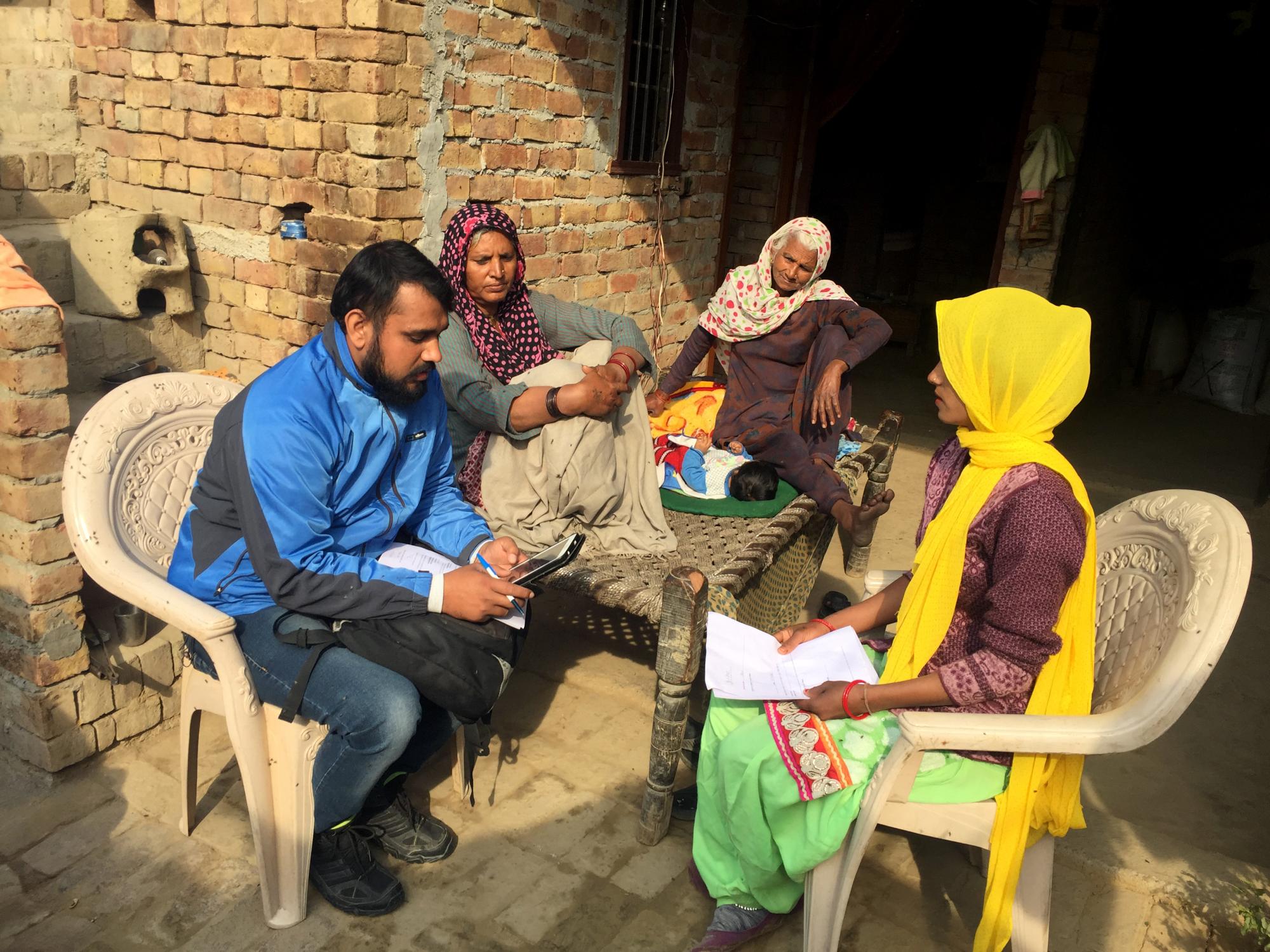 Enumerator administering a child verification survey