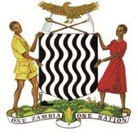 Government of Zambia logo with two people holding shield