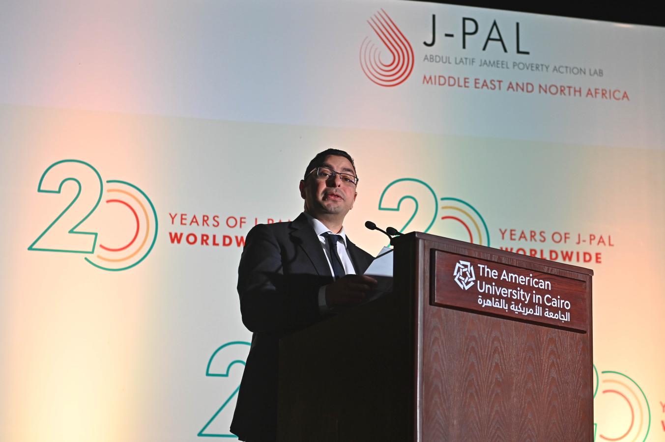 A man stands at a podium