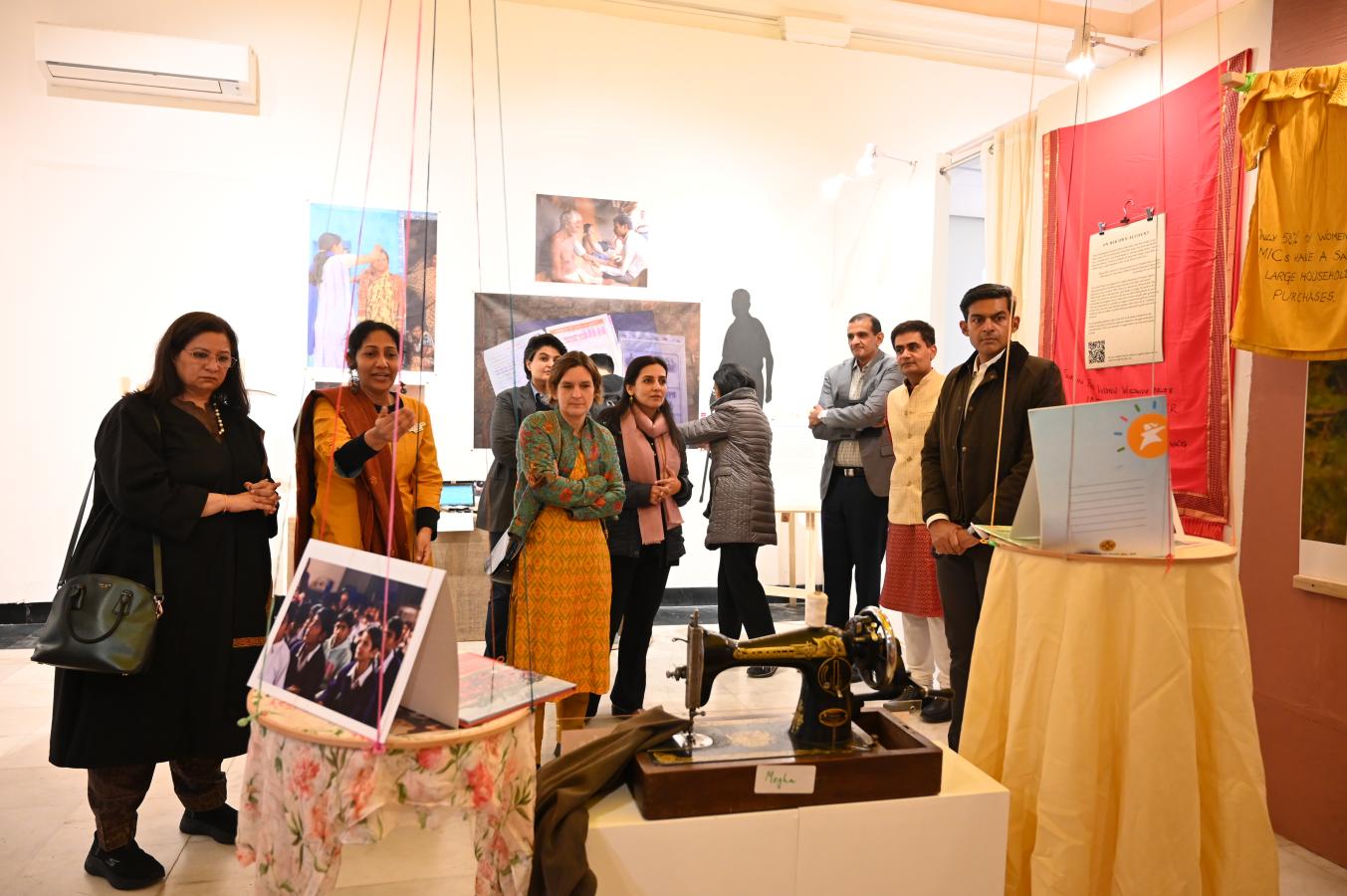 A group of people stand in a room.