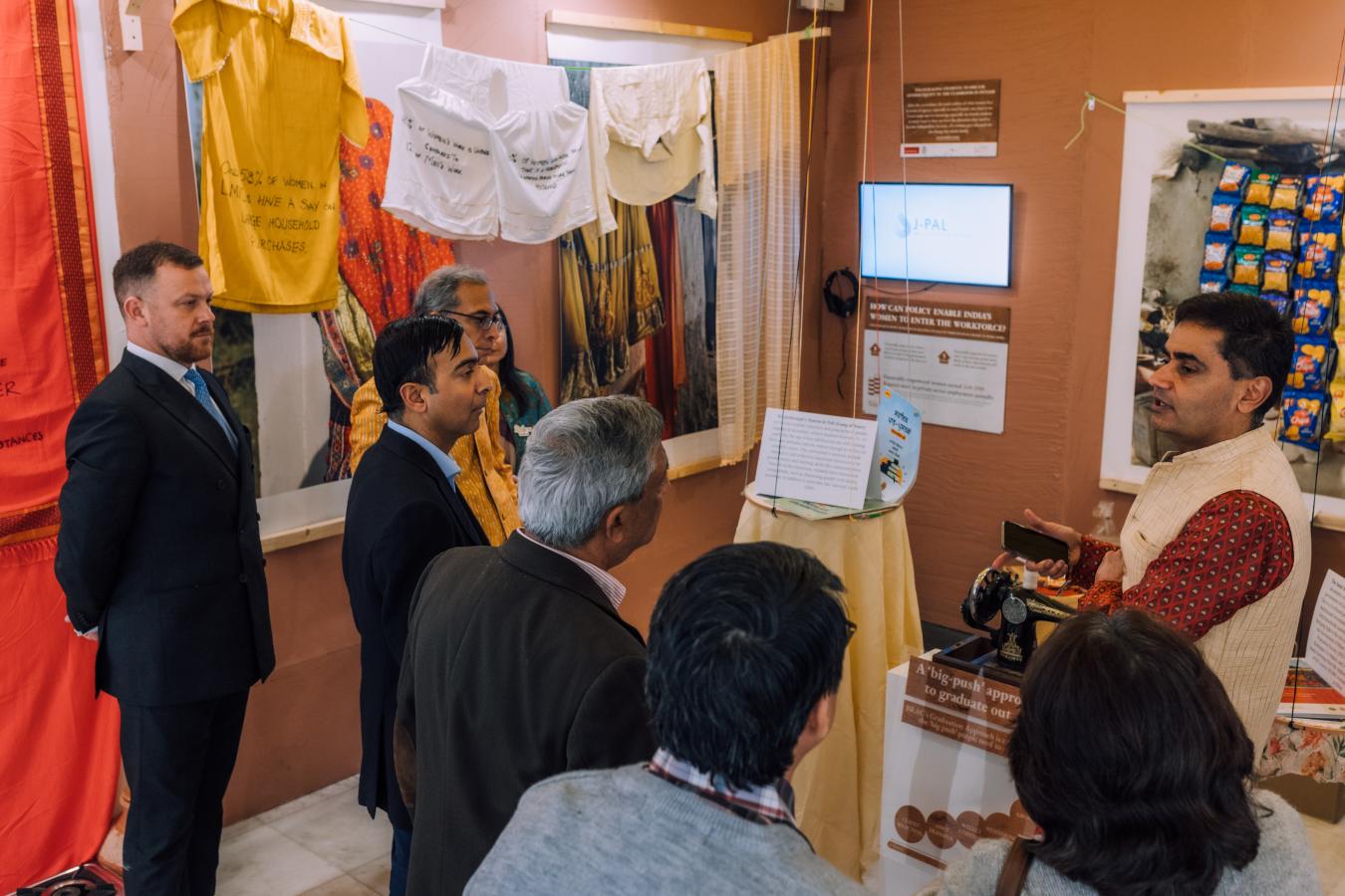 Two women set up an exhibit