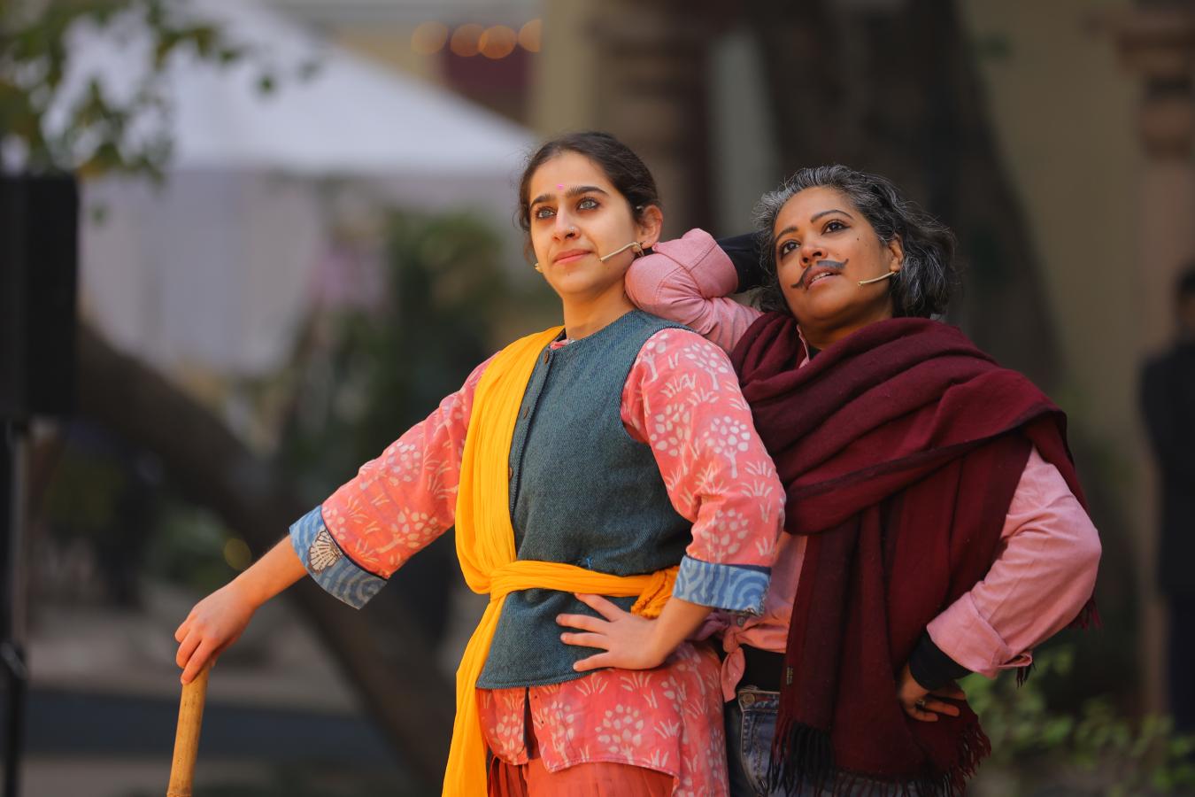 Actors in a theatre presentation looking into the distance