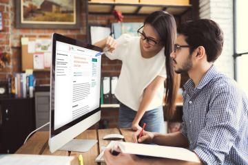 two people looking at a computer screen