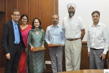 Group of J-PAL staff and Punjab government officials pose for MoU signing