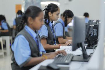 A group of students learning on computers.