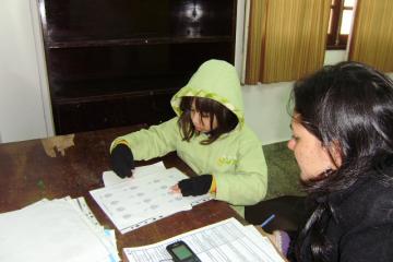 Cold schoolgirl doing her homework