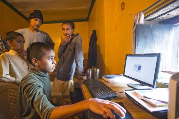 Indian boys sitting at computer