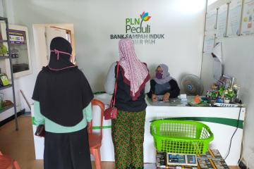 Two women in line at bank