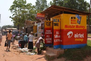 MTN and Airtel Money mobile money agent on the edge of Kampala, Uganda