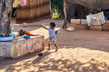 A child plays in a yard in Botswana