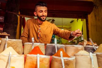 A man works at a spice stall