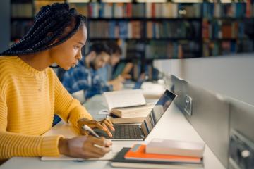 A student studies in a library