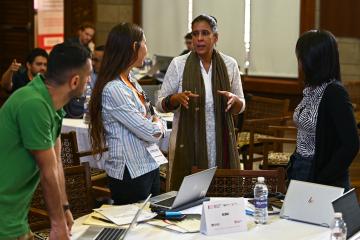 Implementing partners discussing around a table 