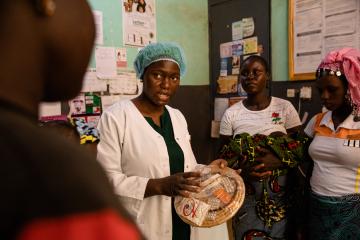 A health worker in the province of Oubritenga, Burkina Faso educates women on contraception options.
