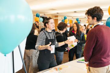 Two people talking to each other in the convening