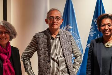 Three people, WFP Director of Evaluation, Anne-Claire Luzot, J-PAL co-founder and Nobel Laureate in Economics, Prof Abhijit Banerjee and WFP Assistant Executive Director for Partnerships and Resource Mobilization, Rania Dagash-Kamara pose in front of blue United Nations flags.