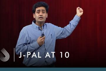 Iqbal Dhaliwal speaking at the J-PAL at 10 event